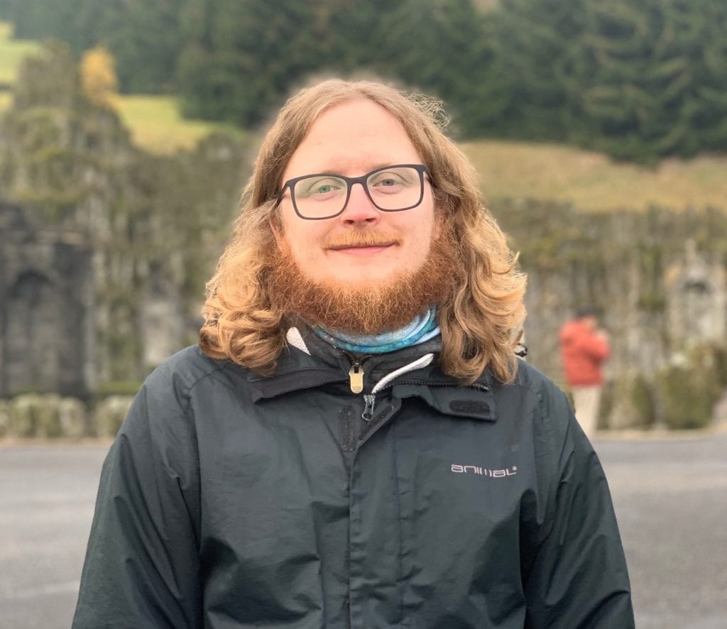 A picture of Michael Macey in front of a building in Germany