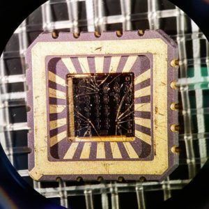 A gold chop carrier with several devices on it.