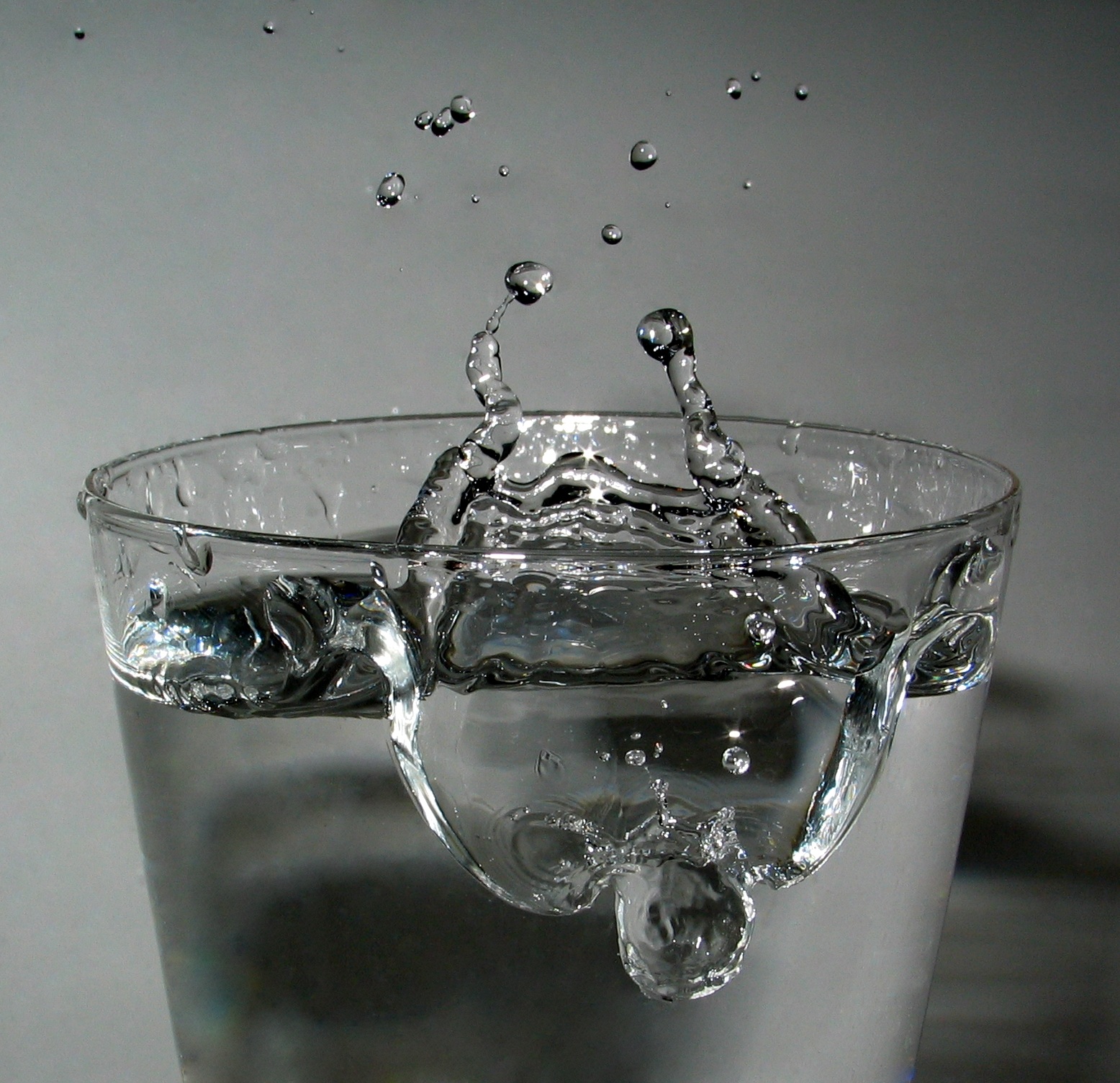 Water droplet falling into a glass
