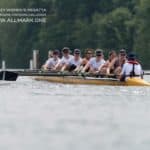 Yellow rowing boat with 8 rowers and cox sitting balanced with square blades
